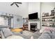 Cozy living room with a fireplace, hardwood floors, and comfortable seating at 6603 Havencrest Dr, Denver, NC 28037