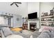 Inviting living room featuring a cozy fireplace, vaulted ceilings, and stylish decor at 6603 Havencrest Dr, Denver, NC 28037