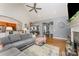 Open-concept living room featuring vaulted ceilings, hardwood floors, and bright, neutral paint at 6603 Havencrest Dr, Denver, NC 28037