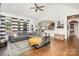 Spacious living area with hardwood floors, modern decor, and a comfortable seating arrangement at 6603 Havencrest Dr, Denver, NC 28037