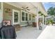 Covered patio with ceiling fan, comfortable seating, and string lights for entertaining at 6603 Havencrest Dr, Denver, NC 28037