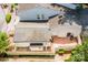 Aerial view of backyard featuring patio, fenced yard, and mature landscaping at 7129 Stonington Ln, Charlotte, NC 28227