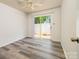 Bedroom with sliding glass doors to backyard and modern, wood-look floors at 7129 Stonington Ln, Charlotte, NC 28227