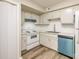 A full shot of a clean kitchen with updated white cabinets at 7129 Stonington Ln, Charlotte, NC 28227
