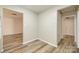 The updated floors shine in a room connecting the entry and kitchen at 7129 Stonington Ln, Charlotte, NC 28227