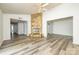 A spacious living room with a stone fireplace and vinyl floors at 7129 Stonington Ln, Charlotte, NC 28227