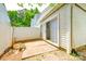 A small backyard with a concrete patio area and a white privacy fence at 7129 Stonington Ln, Charlotte, NC 28227