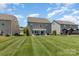 Spacious backyard with lush green lawn and a patio area, great for outdoor activities and entertainment at 7318 Agnew Dr, Charlotte, NC 28278