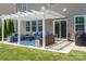 Backyard patio featuring an outdoor seating area under a pergola, perfect for relaxation at 7318 Agnew Dr, Charlotte, NC 28278