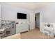 This bedroom offers a bright space with a small play kitchen and a decorative vanity at 7318 Agnew Dr, Charlotte, NC 28278
