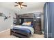 This bedroom features a unique bunk bed with a built-in staircase, dark wood accents, and neutral carpet at 7318 Agnew Dr, Charlotte, NC 28278