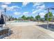 Large community pool featuring lounge chairs and shaded areas, perfect for relaxation and recreation at 7318 Agnew Dr, Charlotte, NC 28278