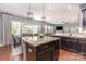 Open kitchen features granite countertops, stainless steel appliances, and dark wood cabinetry at 7318 Agnew Dr, Charlotte, NC 28278