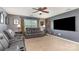 This living room features a large TV, comfy seating, and ample room for entertaining and relaxation at 7318 Agnew Dr, Charlotte, NC 28278
