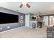 This living room features a large entertainment area with a snack bar and comfortable leather couches at 7318 Agnew Dr, Charlotte, NC 28278