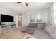 Relaxing living room with large sectional and mirrored accent cabinet at 7318 Agnew Dr, Charlotte, NC 28278