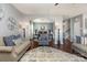 Open-concept living room and dining area with hardwood floors and stylish furnishings at 7318 Agnew Dr, Charlotte, NC 28278