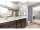 Primary bathroom with double sink vanity and large mirror at 7318 Agnew Dr, Charlotte, NC 28278
