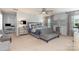 Spacious main bedroom with a stylish bed and comfortable seating area at 7318 Agnew Dr, Charlotte, NC 28278