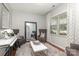 Cozy sitting room with plush carpet, stylish decor, and a large decorative mirror at 7318 Agnew Dr, Charlotte, NC 28278