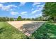 Community sand volleyball court, surrounded by grass and trees, ideal for outdoor recreation at 7318 Agnew Dr, Charlotte, NC 28278