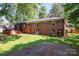 Large brick house showing expansive backyard, wooden deck and grassy lawn in a lush green setting at 851 Gist Rd, Rock Hill, SC 29732