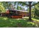 Spacious backyard with deck, lush lawn, and mature trees offering privacy and shade at 851 Gist Rd, Rock Hill, SC 29732