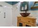 Unique bathroom featuring a vessel sink, white tile shower, and blue accent wall at 851 Gist Rd, Rock Hill, SC 29732