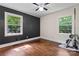 Bright bedroom with hardwood floors, large windows, and stylish black accent wall at 851 Gist Rd, Rock Hill, SC 29732