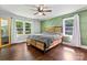 Bright bedroom featuring a wooden bed frame, hardwood floors, and natural light at 851 Gist Rd, Rock Hill, SC 29732