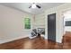 Bright bedroom with hardwood floors, natural light, and shelving for extra storage at 851 Gist Rd, Rock Hill, SC 29732
