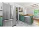 Kitchen with stainless steel refrigerator, butcher block countertops, and green painted cabinets at 851 Gist Rd, Rock Hill, SC 29732