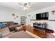 Comfortable living room with hardwood floors, stylish décor, and a ceiling fan for added comfort at 851 Gist Rd, Rock Hill, SC 29732