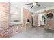 Enclosed patio with brick accent wall, concrete floor, and access to the laundry room at 851 Gist Rd, Rock Hill, SC 29732