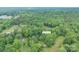 Aerial view of property located at 857 Hills Rd, surrounded by lush greenery and trees at 857 Hills Rd, Belmont, NC 28012