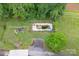 Aerial view of backyard with pool, fire pit and surrounding greenery at 857 Hills Rd, Belmont, NC 28012