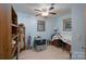 Cozy bedroom featuring a ceiling fan, hardwood floors, and a warm, inviting atmosphere at 857 Hills Rd, Belmont, NC 28012