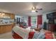 Open-concept living room featuring a fireplace, big windows, wood floors and seamless flow to the kitchen at 857 Hills Rd, Belmont, NC 28012