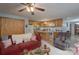 Comfortable living room offering an open floor plan, a breakfast bar, and modern wood floors at 857 Hills Rd, Belmont, NC 28012