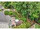 Aerial view of the backyard with a patio, grilling area, fire pit, and lush greenery at 9075 Blue Ridge Dr, Indian Land, SC 29707