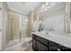 Bathroom featuring a shower and a vanity with a dark finish at 9075 Blue Ridge Dr, Indian Land, SC 29707