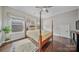 Bedroom featuring wood floors, a four-poster bed and a window at 9075 Blue Ridge Dr, Indian Land, SC 29707