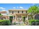 Brick home with a patio, an umbrella, and lush landscaping in the backyard at 9075 Blue Ridge Dr, Indian Land, SC 29707