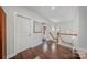 Upstairs hallway with hardwood floors and access to other rooms at 9075 Blue Ridge Dr, Indian Land, SC 29707