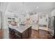 Bright kitchen boasts granite counters, stainless appliances, and a large center island for cooking prep and entertaining at 9075 Blue Ridge Dr, Indian Land, SC 29707