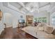 Cozy living room with stone fireplace, coffered ceiling, and hardwood floors at 9075 Blue Ridge Dr, Indian Land, SC 29707