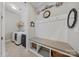 Convenient mud room offers a built-in bench, storage, and easy access to the laundry area at 9075 Blue Ridge Dr, Indian Land, SC 29707