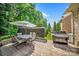 Spacious patio with grilling area, a table, and chairs, perfect for outdoor dining and entertainment at 9075 Blue Ridge Dr, Indian Land, SC 29707