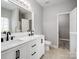 Bathroom with double sink vanity, granite countertops, and modern fixtures at 908 Sundance Dr, Gastonia, NC 28054