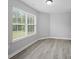 Bedroom with luxury vinyl plank flooring and large windows providing natural light at 908 Sundance Dr, Gastonia, NC 28054